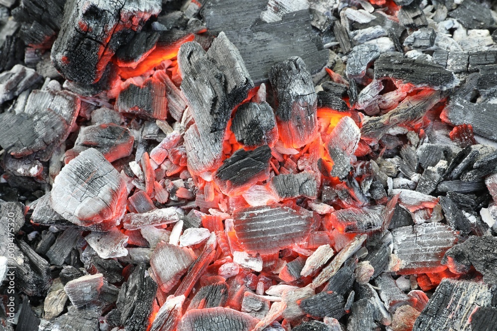 Many smoldering coals as background, closeup view Many smoldering coals as background, closeup view