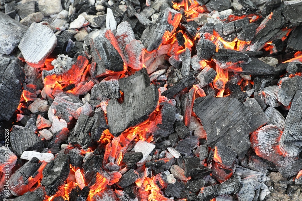 Many smoldering coals as background, closeup view Many smoldering coals as background, closeup view