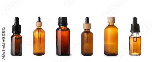 Set of different cosmetic oils in bottles on white background