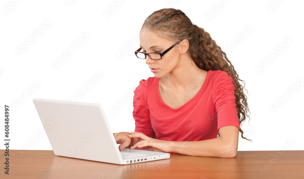 Girl Sitting Behind Desk and Using Laptop - Isolated Girl Sitting Behind Desk and Using Laptop - Isolated