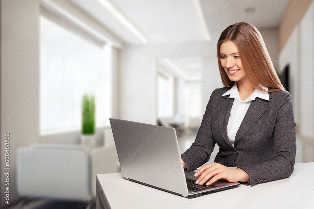 Portrait of happy business woman using laptop Portrait of happy business woman using laptop