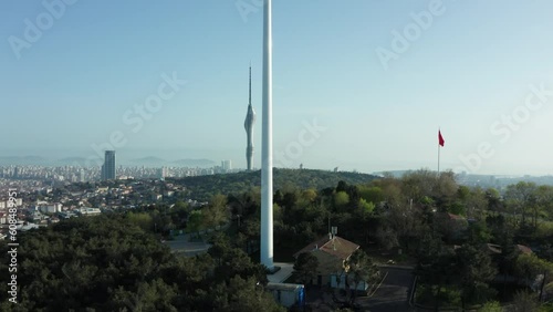 Aerial view of the glorious Turkish flag waving from the hill, which has the most beautiful view of Istanbul, which sees the bridge connecting Asia and Europe.