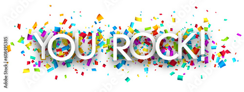 You rock sign on colorful cut ribbon confetti background.