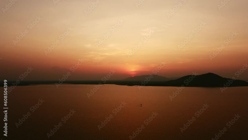 Aerial shot of Landscape at the end of Pa Sak Jolasid Dam on sunset. the new destination for camping and rest on holiday at Ban Tha Rit, Wang Muang District, Saraburi Province. travel concept Aerial shot of Landscape at the end of Pa Sak Jolasid Dam on sunset. the new destination for camping and rest on holiday at Ban Tha Rit, Wang Muang District, Saraburi Province. travel concept
