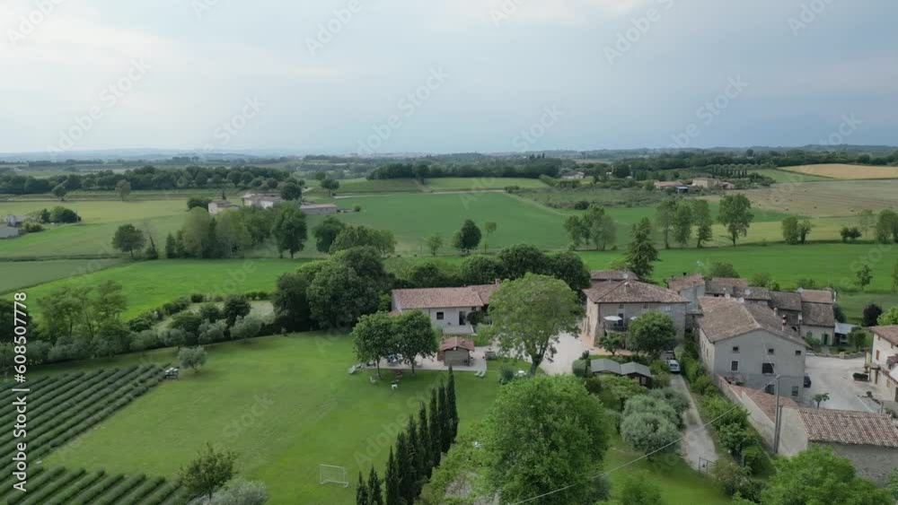 DRONE PERFORMS A DESCENDING SPIRAL MANEUVER OVER A FARMHOUSE NEAR GARDA LAKE IN ITALY DRONE PERFORMS A DESCENDING SPIRAL MANEUVER OVER A FARMHOUSE NEAR GARDA LAKE IN ITALY