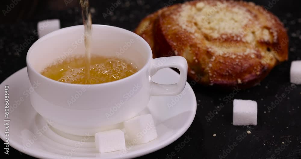 Preparation of green tea for a sweet dessert, a wheat bun with filling and a mug of hot green tea Preparation of green tea for a sweet dessert, a wheat bun with filling and a mug of hot green tea