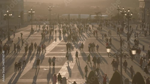 Crowd of People and Catedral de la Almudena during Sunset Madrid, Spain photo
