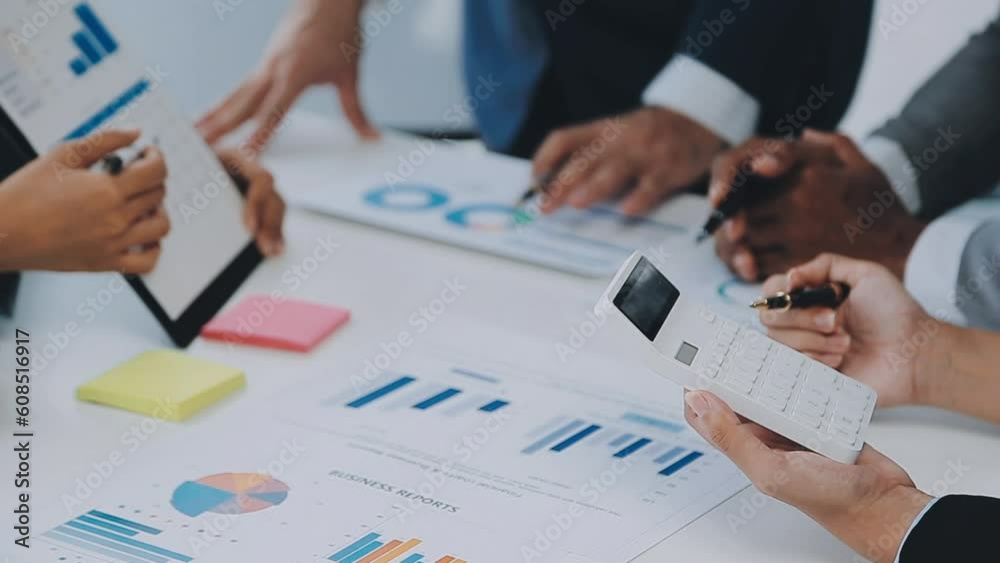 Group of coworkers in formal wear sitting at table in conference room and arguing about project of company development during meeting Group of coworkers in formal wear sitting at table in conference room and arguing about project of company development during meeting