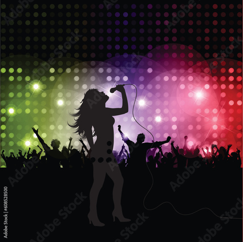 Silhouette of a female singer performing in front of a crowd