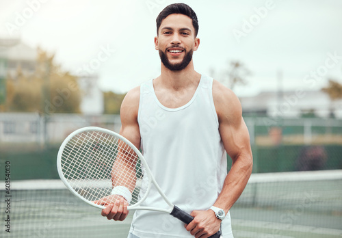 Fitness, tennis and portrait of man with racket, sport mindset and confidence for happy game on court. Workout goals, pride and happiness, male athlete with motivation for health, wellness and sports © Clement C/peopleimages.com