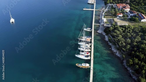 Embark on a blissful sailing escape, surrounded by stunning bays and holiday vibes. Experience the allure of turquoise waters and captivating drone shots at sunrise. #SailLife #BayLife #HolidayVibes photo