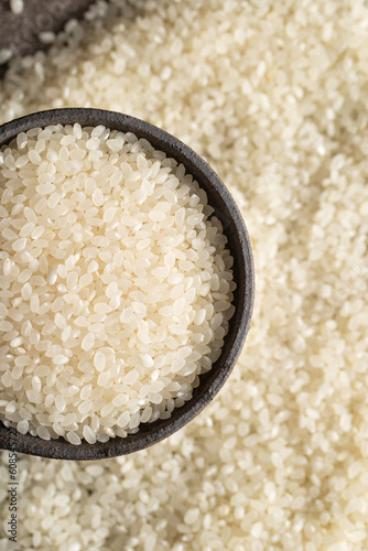 raw rice in stone bowl 