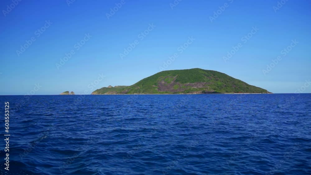 An island in the sea. Not far from Nha Trang in Vietnam. Slow motion from a boat. An island in the sea. Not far from Nha Trang in Vietnam. Slow motion from a boat.