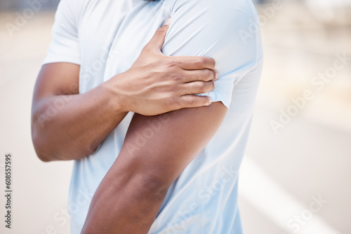 Arm pain, sport injury and person with muscle, inflammation and accident from fitness. Outdoor, athlete and injured joint in arms from workout, exercise and training on a road for wellness and health