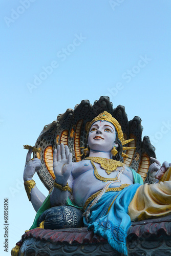 Canvas Print Vertical photo of Vishnu god statue with space on top