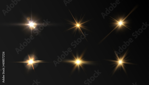Set of light effects golden glowing light isolated on transparent background. Solar flare with rays and glare. Glow effect. Starburst with shimmering sparkles.	