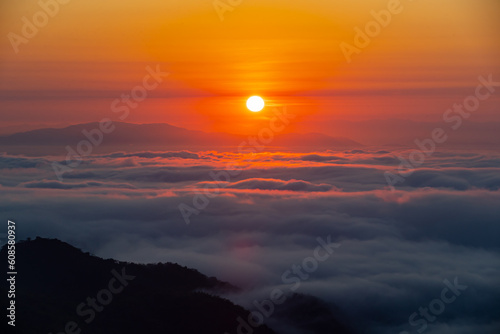 sunrise in the mountains. Sunrise fog in the morning in mountains. Mountain valley sunrise. © Worrawit