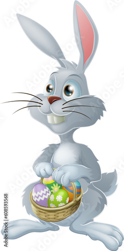 The Easter bunny with a basket full of painted Easter eggs