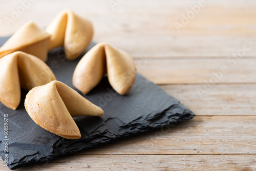 Traditional fortune cookies on wooden table. Copy space