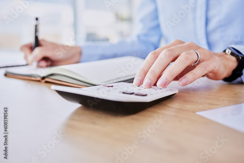 Hands, typing and calculator in office closeup for audit, tax or bookkeeping for compliance, budget or planning. Accounting person, writing and notebook for banking, profit or financial data at desk