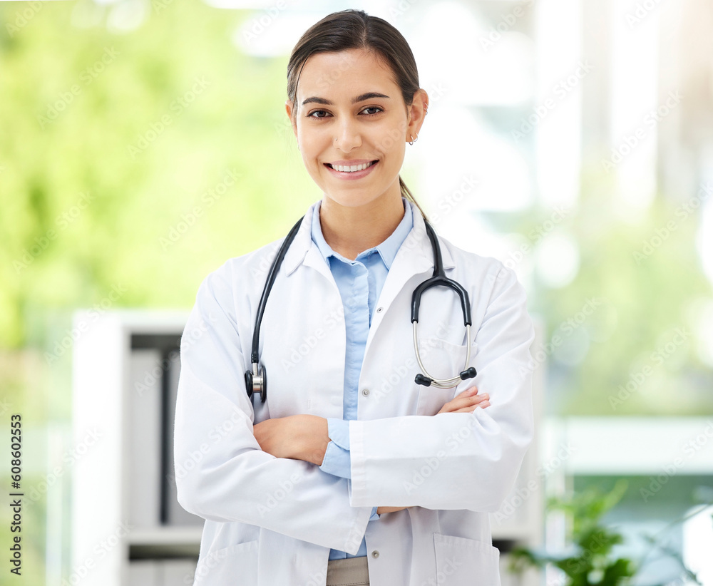 Portrait, medical and arms crossed with a doctor woman in the hospital for insurance or treatment. Healthcare, happy or smile with a young female medicine professional standing alone in a clinic