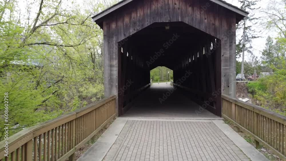Ada covered bridge wooden bridge in Ada Michigan 4k exterior shot Ada covered bridge wooden bridge in Ada Michigan 4k exterior shot
