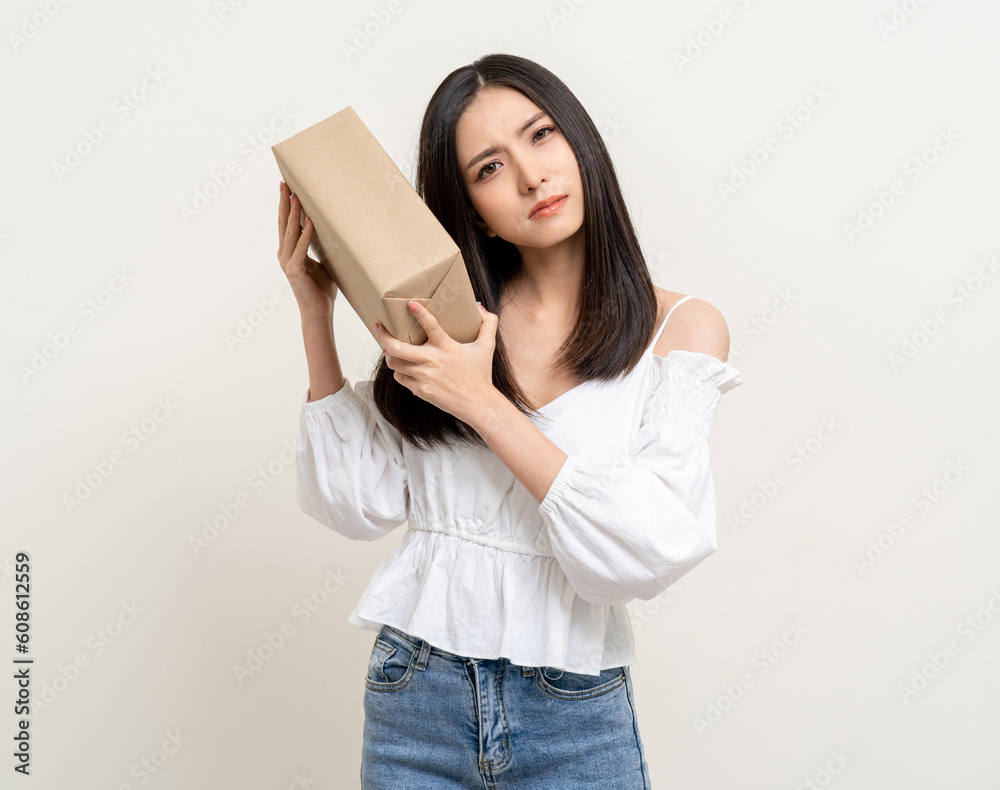 Young excited beautiful asian woman with many parcel cardboard guess what inside the box. Cheerful female holding lot of parcel box receive from the delivery service Young excited beautiful asian woman with many parcel cardboard guess what inside the box. Cheerful female holding lot of parcel box receive from the delivery service