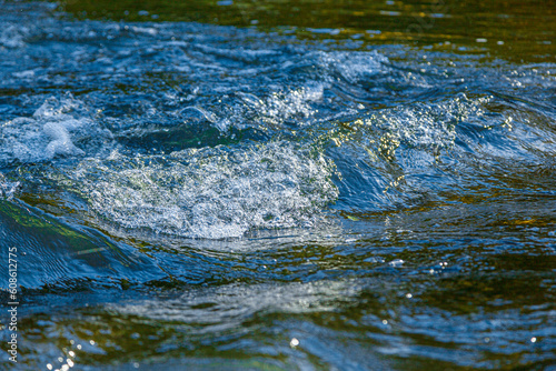 flow of water and spray from a stone