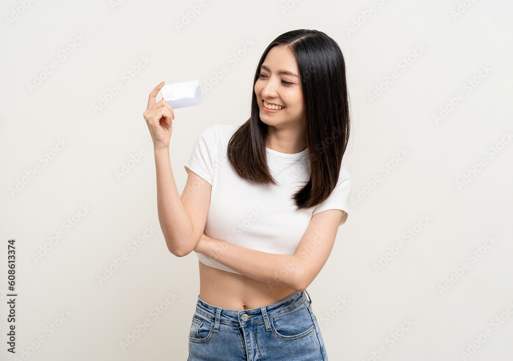 Portrait beautiful asian women standing pose holding credit card to shopping payment. Attractive Happy business woman with credit card financial concept. Portrait beautiful asian women standing pose holding credit card to shopping payment. Attractive Happy business woman with credit card financial concept.