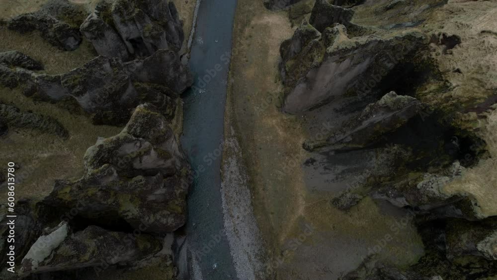 Fantastic aerial shot of the Fjaðrárgljúfur canyon, which fully reveals the canyon and the bridge that connects both sides. in iceland Fantastic aerial shot of the Fjaðrárgljúfur canyon, which fully reveals the canyon and the bridge that connects both sides. in iceland