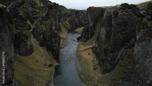 Fantastic panoramic aerial shot of the Fjaðrárgljúfur canyon where you can see the olive green color of the time of year. in iceland photo