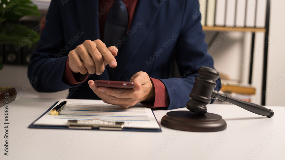 Male lawyer working with law book, A legal binding, Unilateral contract, Multilateral, Non-reciprocal contract, Default, Obligation, Power of attorney, Defense of a prescription, Court decree