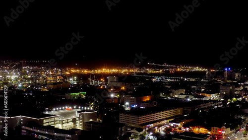 Novorossiysk, Russia. Port of Novorossiysk at night. Night city lights. Tsemesskaya Bay in the Black Sea, Aerial View