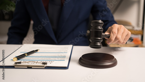 Male lawyer working with law book, A legal binding, Unilateral contract, Multilateral, Non-reciprocal contract, Default, Obligation, Power of attorney, Defense of a prescription, Court decree