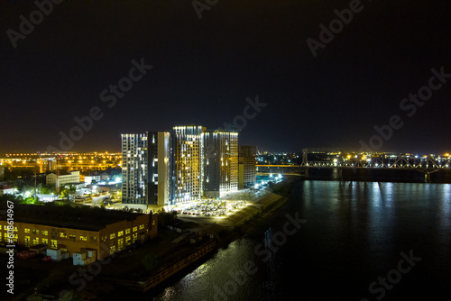 Astrakhan  Russia. Modern residential complex. Embankment of the river Volga. Night city lights. Aerial view