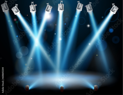 A blue spotlight background concept with lots of lights like spotlights in a light show or during a dramatic theatre stage performance