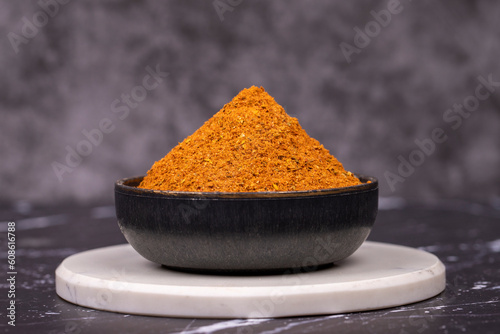 Photos Cajun spice powder on dark background