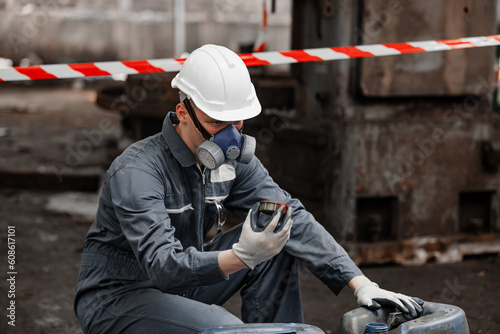 Industrial waste inspector examines the correct storage of hazardous chemicals, radioactive materials, toxic substances. Analyzing impact of factory's existing projects, suggesting solutions