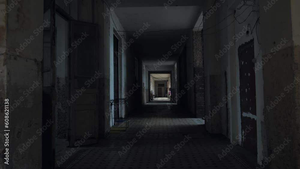Corridor of abandoned ruined building inside which refugees now live as shelter. Corridor of abandoned ruined building inside which refugees now live as shelter.