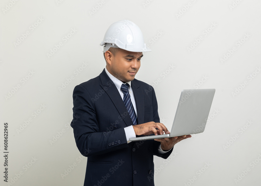 Businessman manager owner real estate working with laptop computer on isolated white background. Cooperation of architect designer. Engineer with safety helmet checking at working construction site