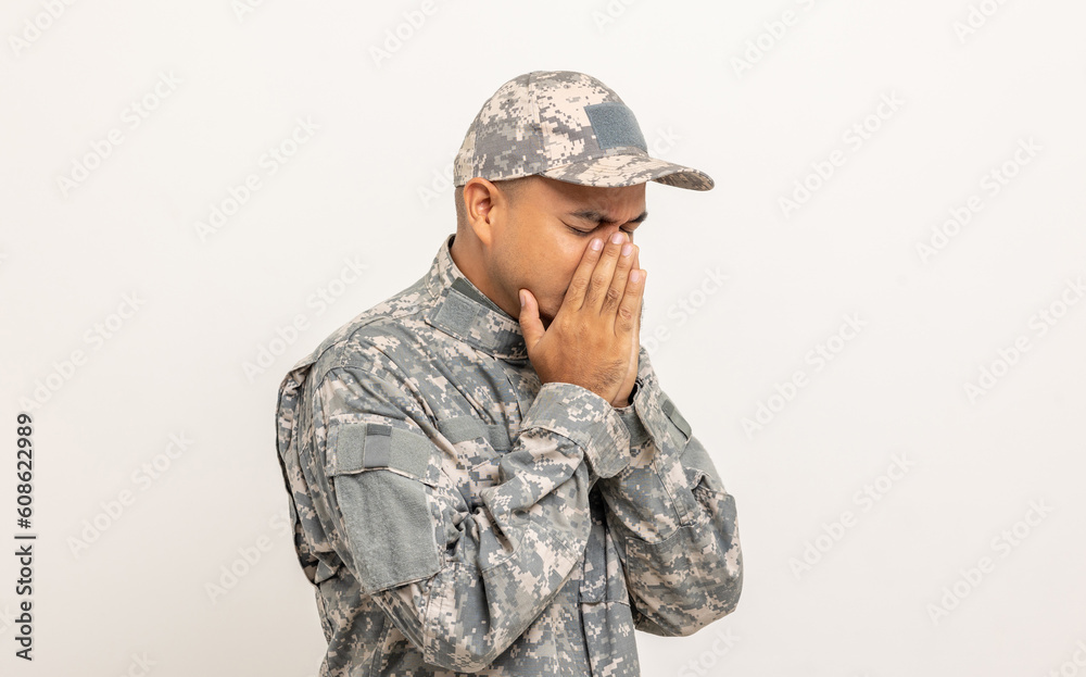 Stressed depressed crying lose war Asian man special forces soldier against on isolated. Commander Army soldier military defender of the nation in uniform standing in studio white background