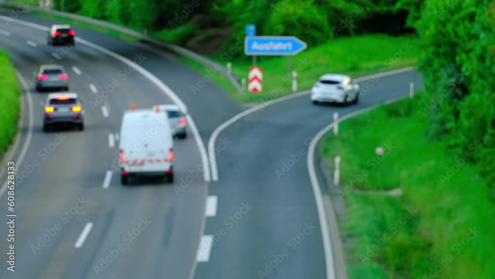 close-up of high-speed asphalt road in europe, blurred cars are driving, freight transport, trucks driving, concept of traveling, way to work, traffic safety, cargo transportation, exit from motorway close-up of high-speed asphalt road in europe, blurred cars are driving, freight transport, trucks driving, concept of traveling, way to work, traffic safety, cargo transportation, exit from motorway