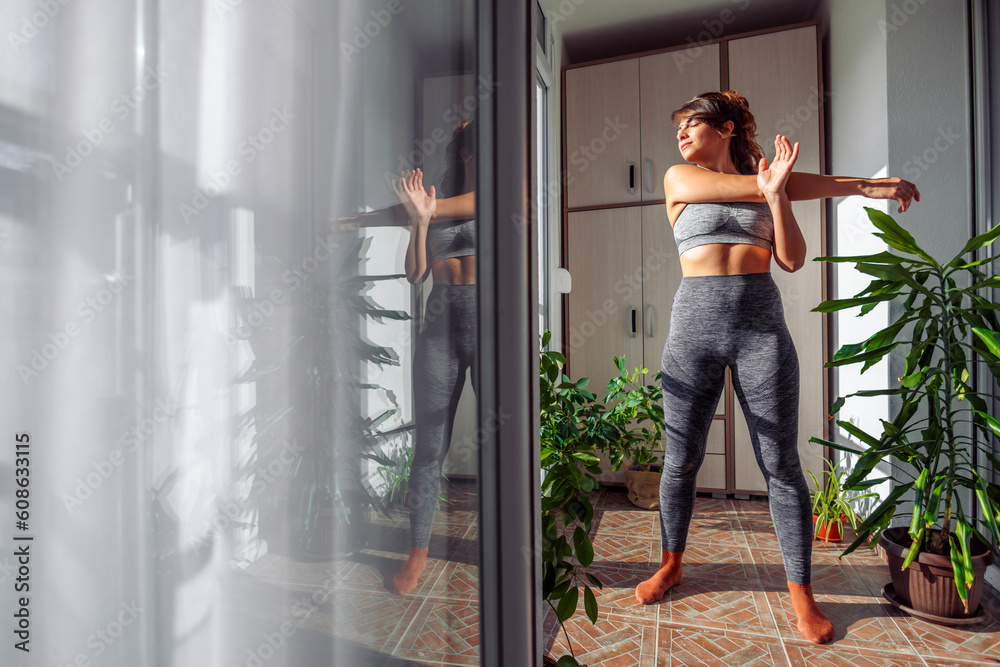 © Impact Photography - Woman stretching arms after workout © Impact Photography - Woman stretching arms after workout