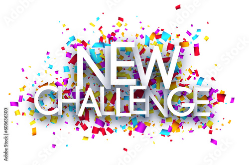 New challenge sign on colorful cut ribbon confetti background.