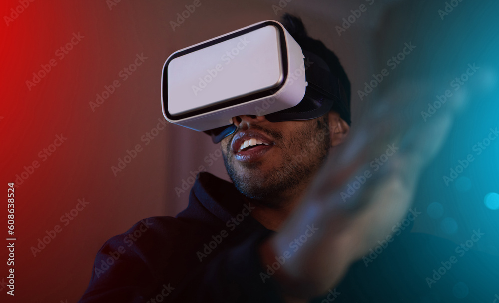 Man in dark room, video game and VR goggles, online streaming with gaming, metaverse and esports. Neon, cyber space with male streamer and future technology with games and virtual reality simulation Man in dark room, video game and VR goggles, online streaming with gaming, metaverse and esports. Neon, cyber space with male streamer and future technology with games and virtual reality simulation