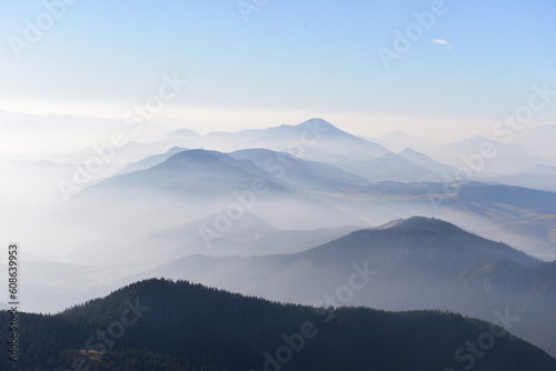 Fototapeta Naklejka Na Ścianę i Meble -  Beautiful view of the mountains with knee timber and clear blue sky on peaks in a fogg. West Tatras, Slovakia.