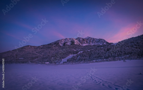 Sunset view Tressdorf and Troepolach on the border between Italy and Austria. Nassfeld ski resort in 5km. January 2022 photo