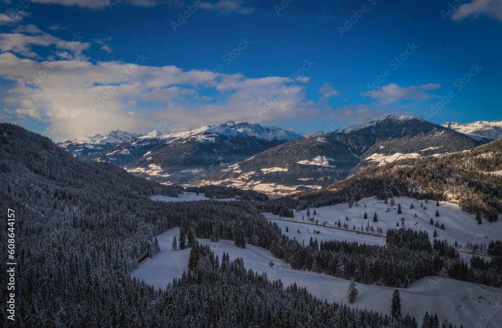 A Mountain valley near Techendorf and lake Weissensee in Carinthia or Karnten, Austria. Panoramic aerial drone picture. January 2022