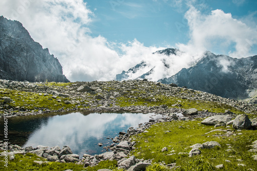 Tourists are hiking in the Great Cold Valley to Zbojnicka cottage in High Tatras, Slovakia.