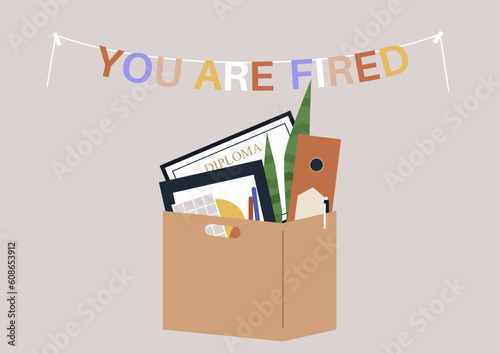 You are fired garland on a wall and a cardboard box of personal belongings, a corporate layoff concept